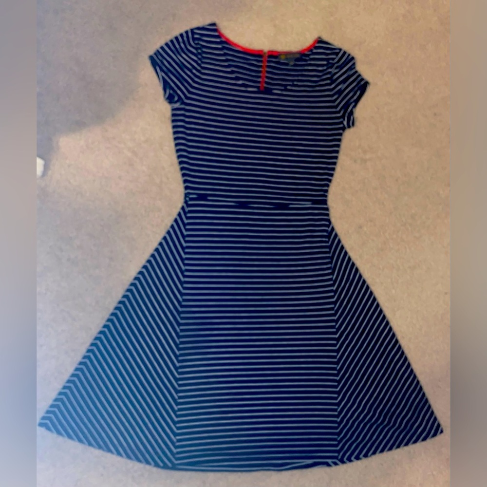 Outback Red dress, snug on top, flared on the bottom, right above knee length.